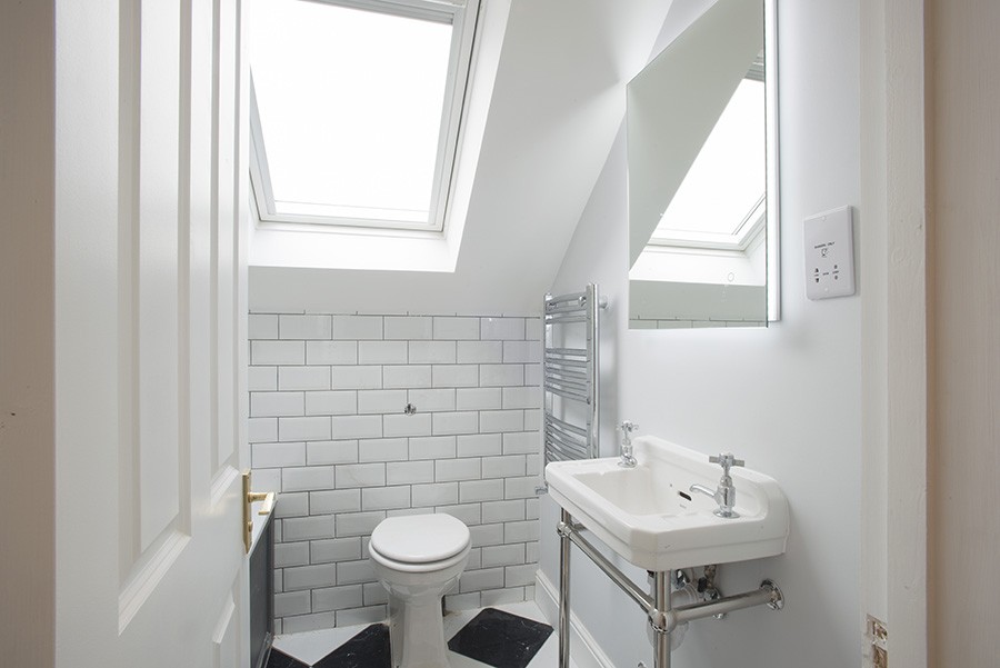 Hiding the cistern can help compact bathrooms.