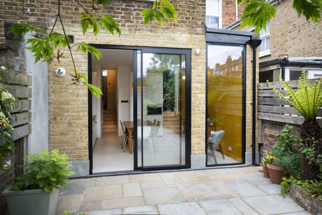 Flat roof with high boundary walls.