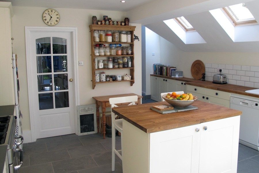 Finished kitchen-diner fit-out in a London extension with island and bifold doors