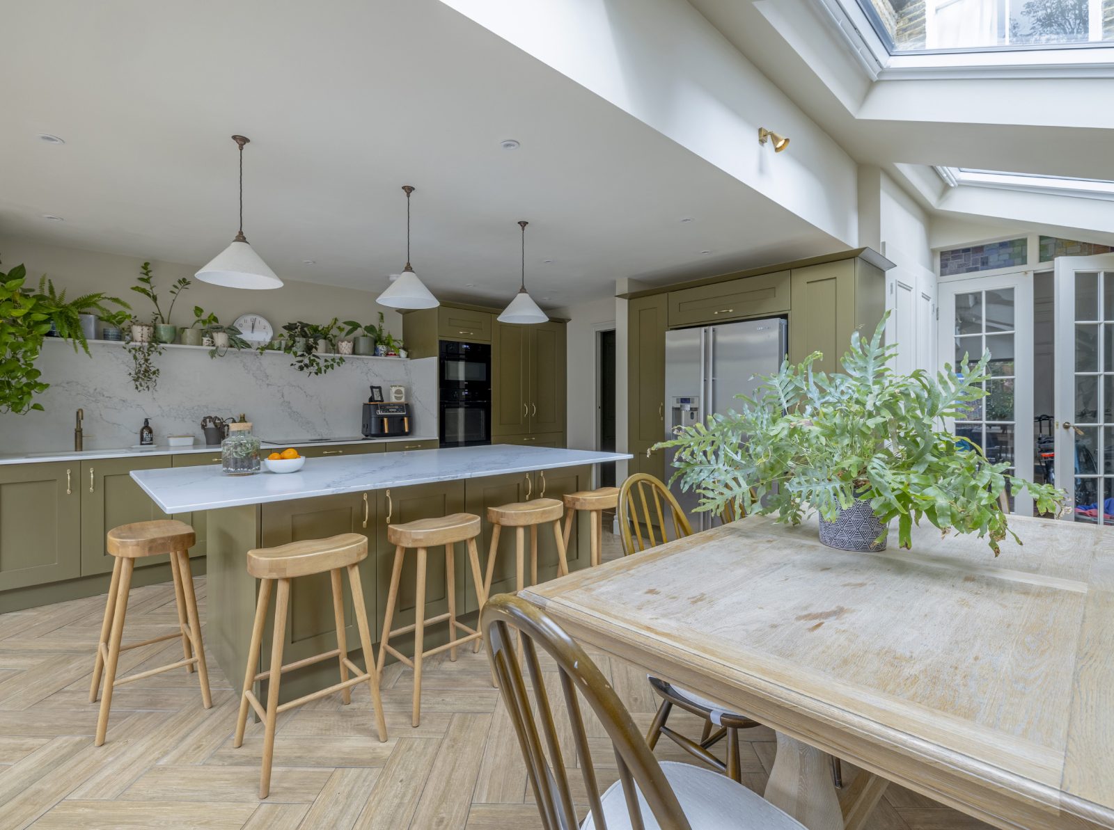 Herringbone wood flooring and open shelving at Mayfield Road N8
