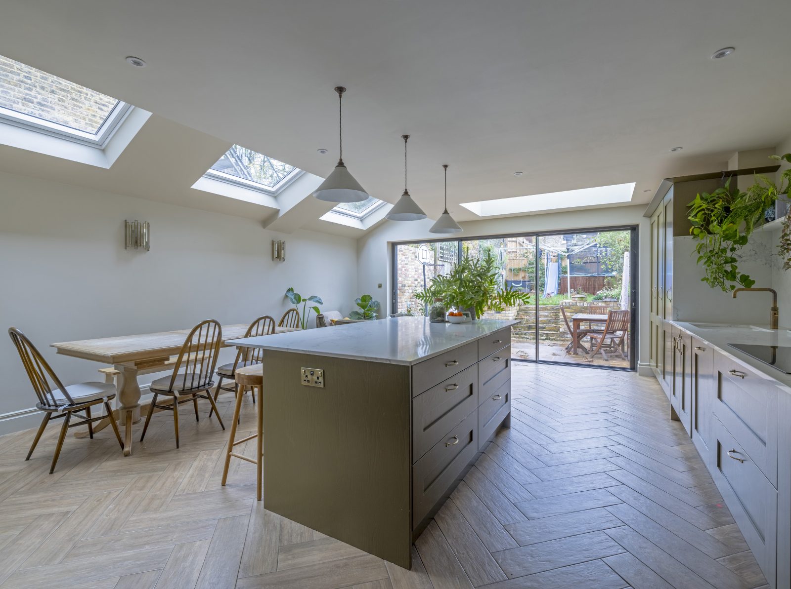 Pendant lighting above the kitchen island at Mayfield Road N8