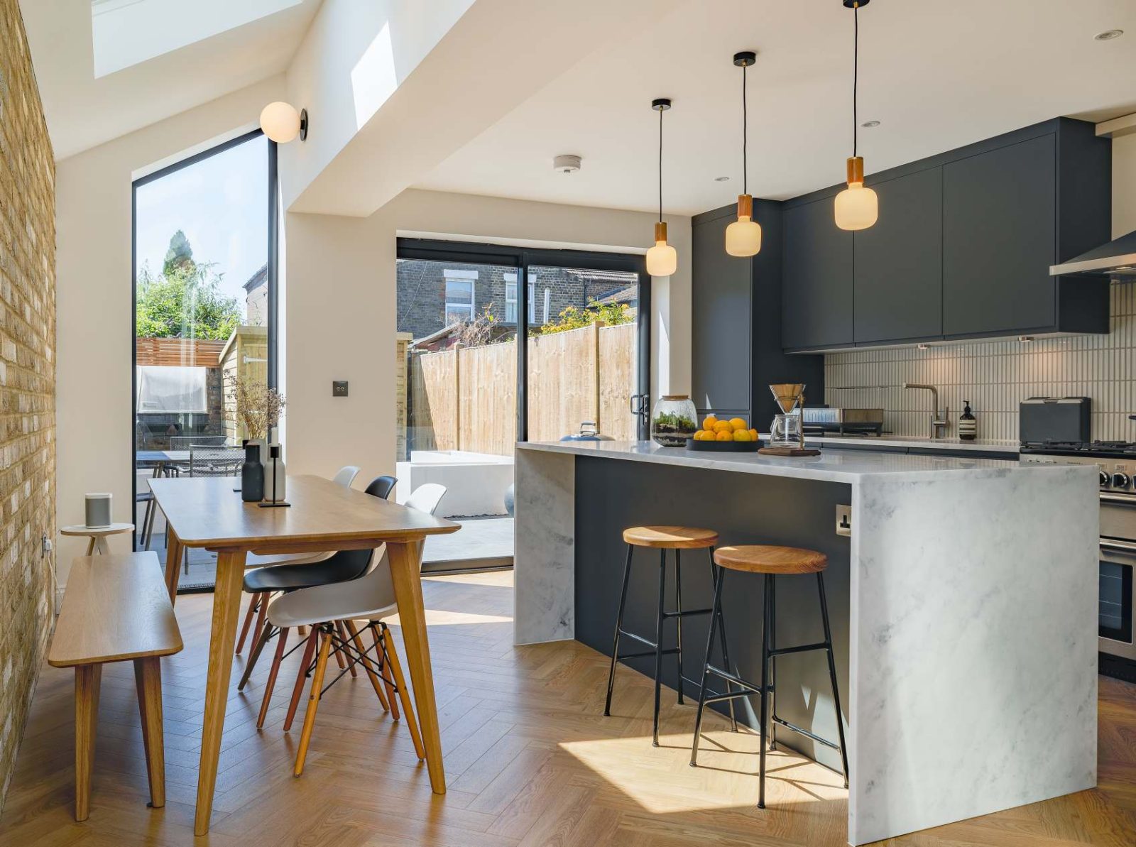Kitchen island and dining area at Antill Road N15 side infill extension