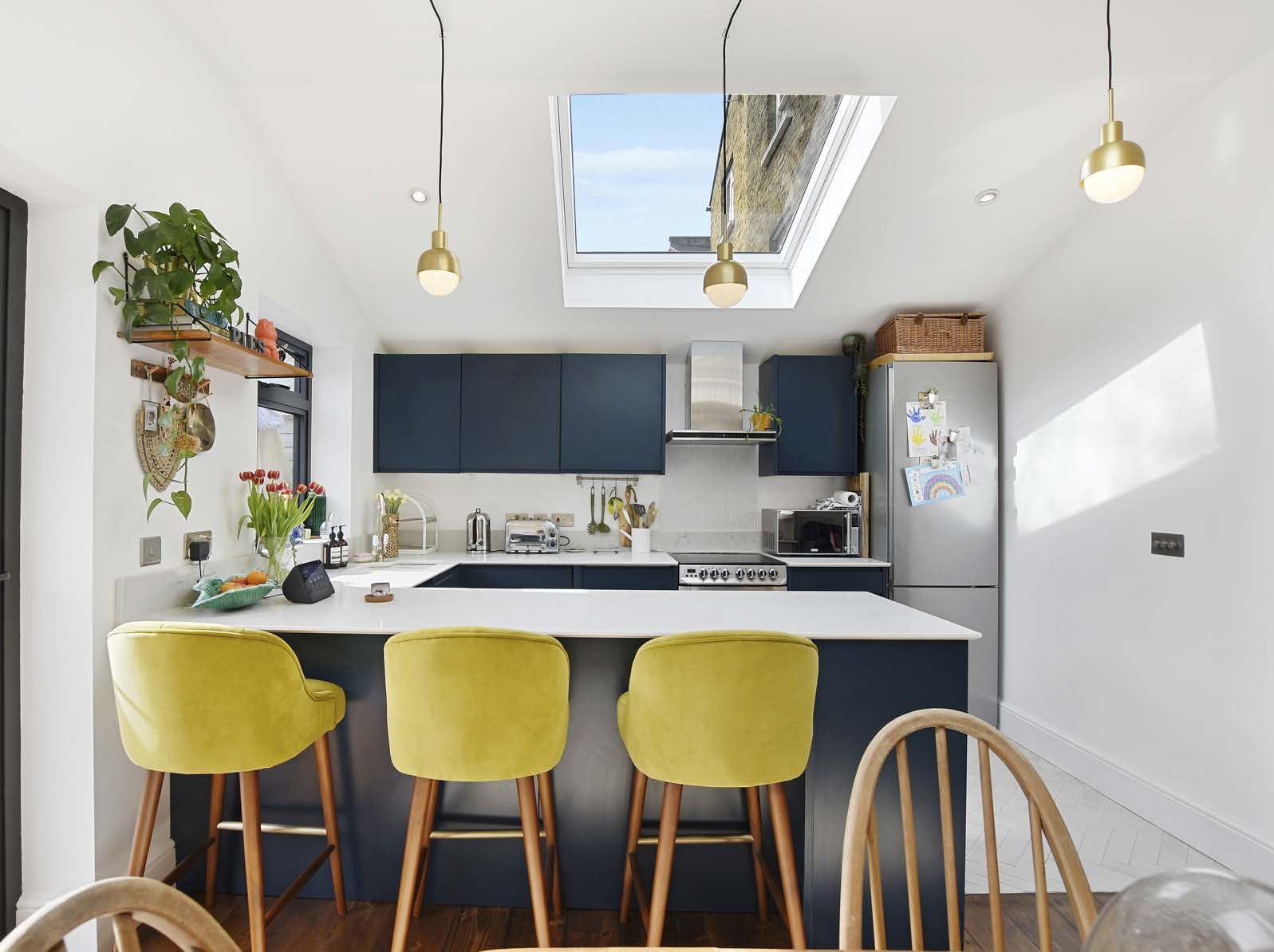 Kitchen with island seating and pendant lighting, East Dulwich Grove wraparound extension