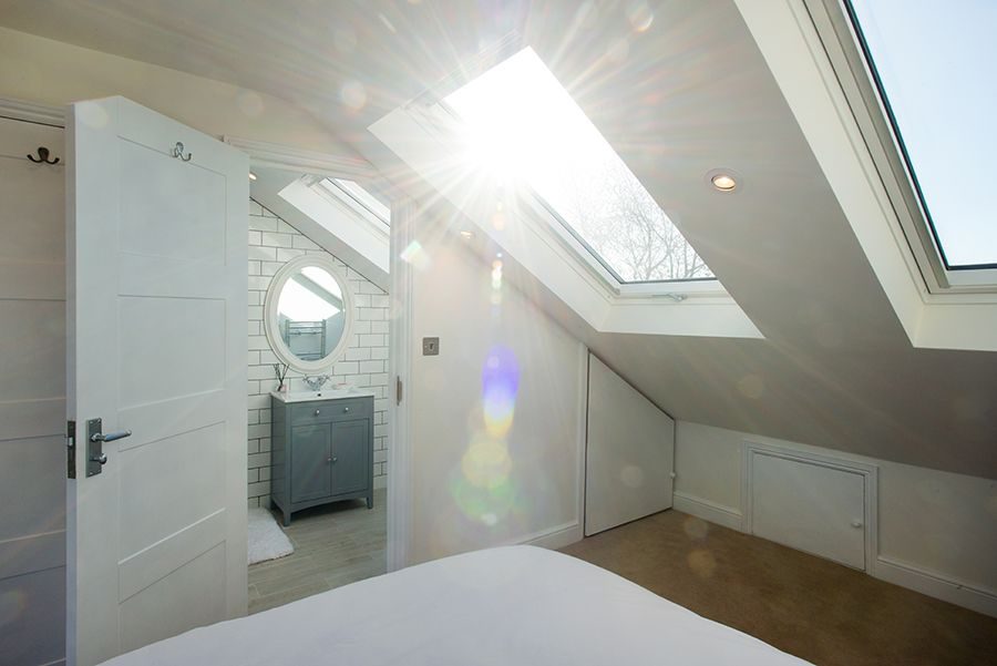 Loft bedroom with ensuite created by a loft conversion, London