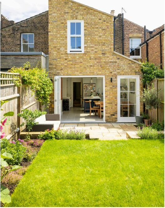 Milton Road extension viewed from the garden, matching the Victorian terrace in a Lambeth conservation area