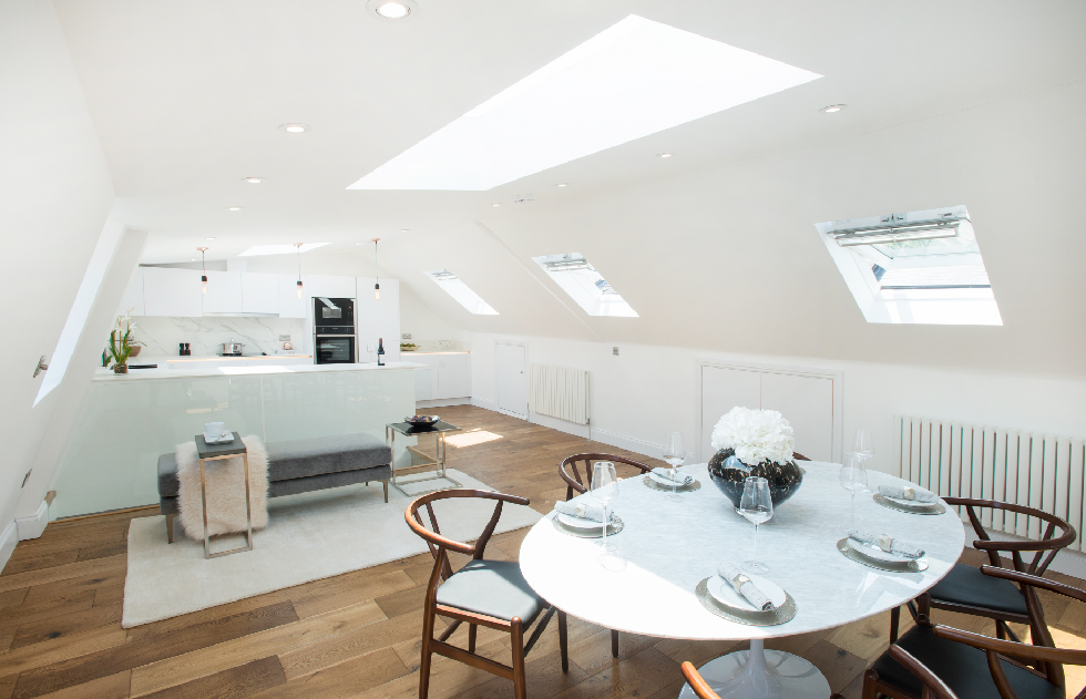 Stylish loft conversion, optimising space with expert design for a functional and inviting elevated living area.