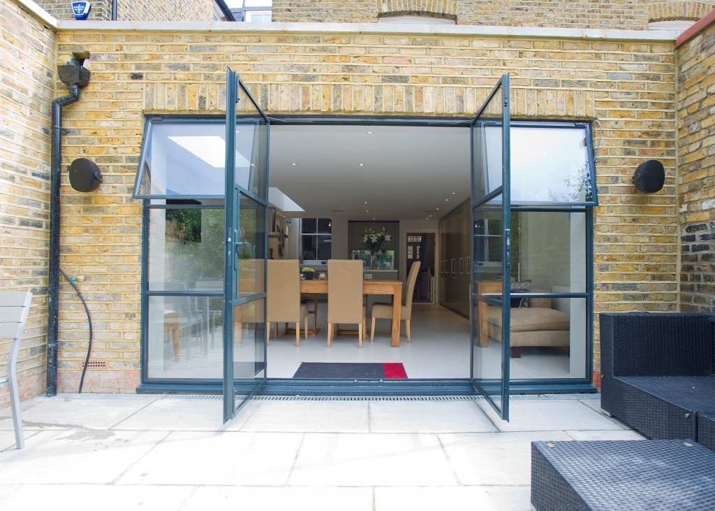 Aluminium-framed French doors opening to a garden