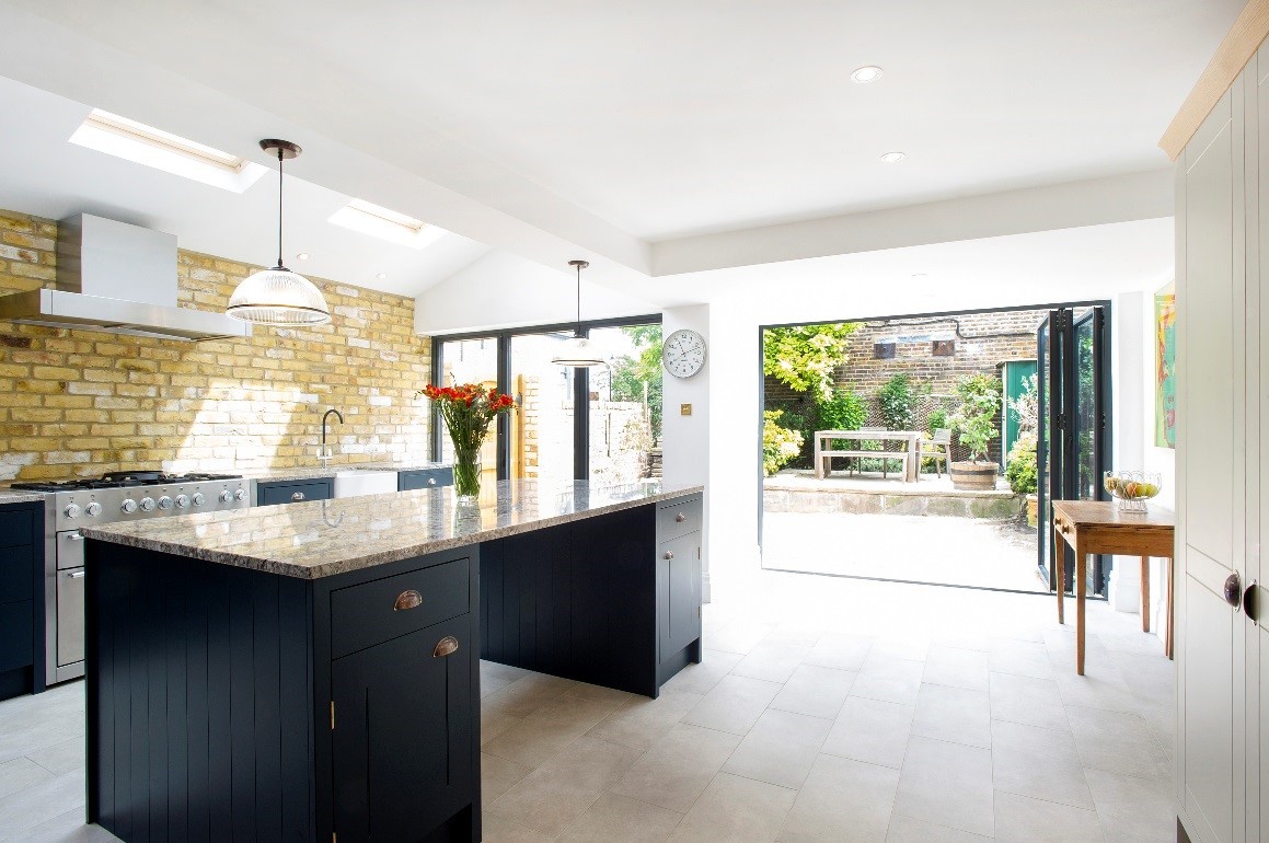 Kitchen extension with a distressed brick feature wall