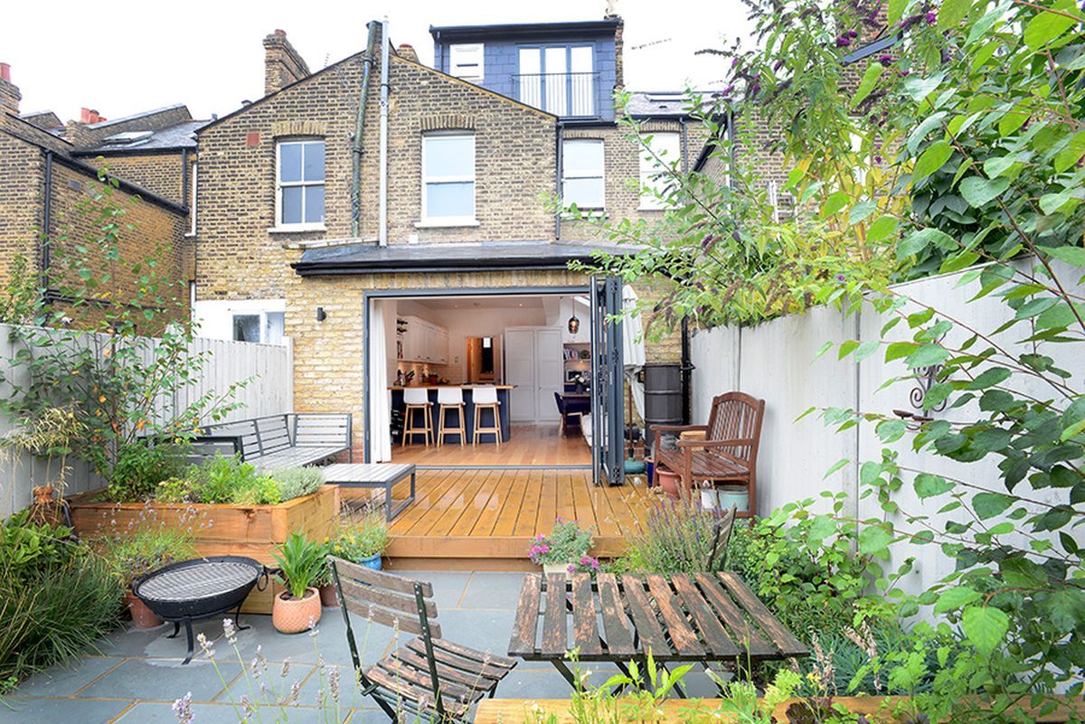 Bifold doors opening onto the garden deck at Littlewood SE13