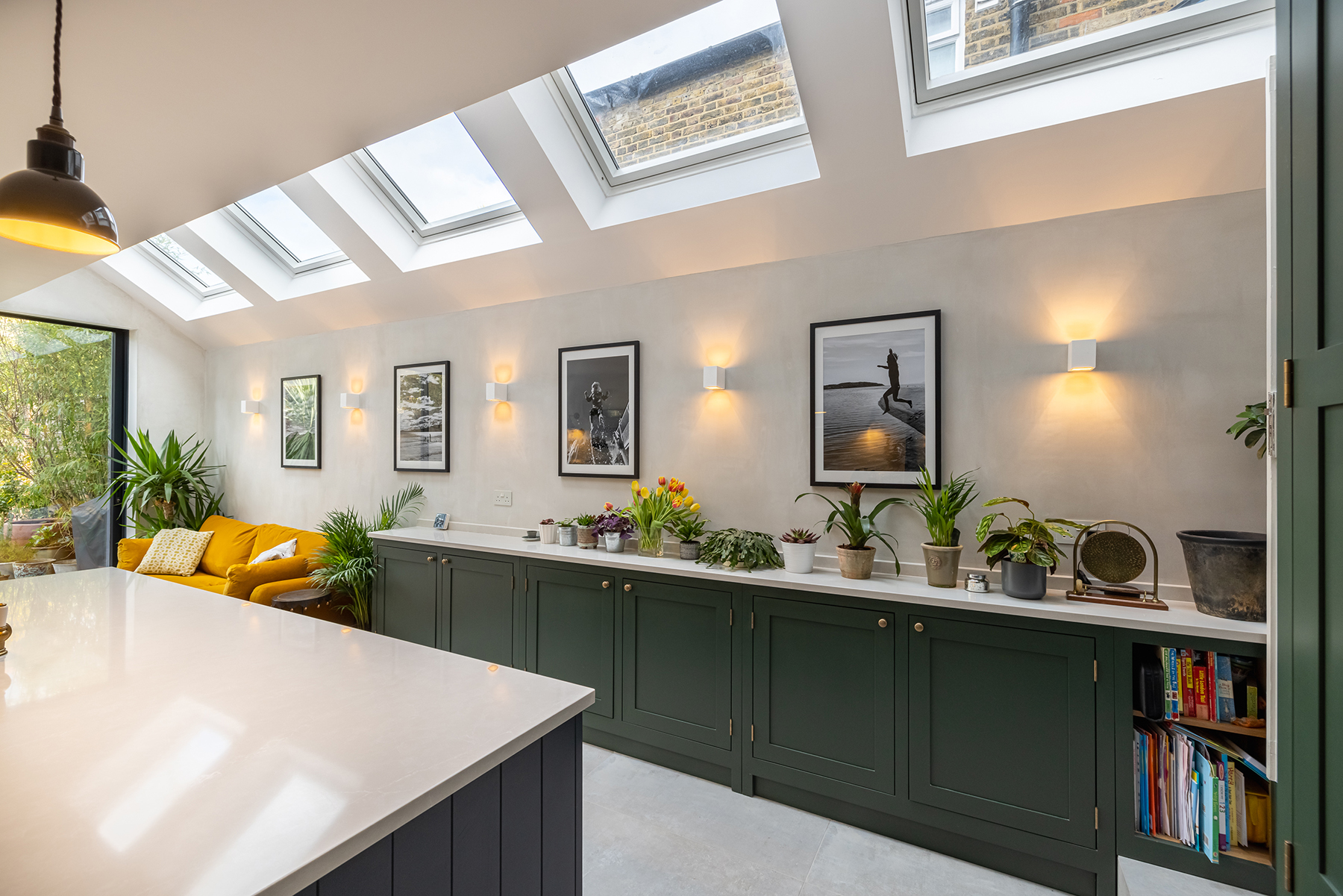 Shaker-style kitchen with olive green and dark blue cabinetry at Scholars Road SW12
