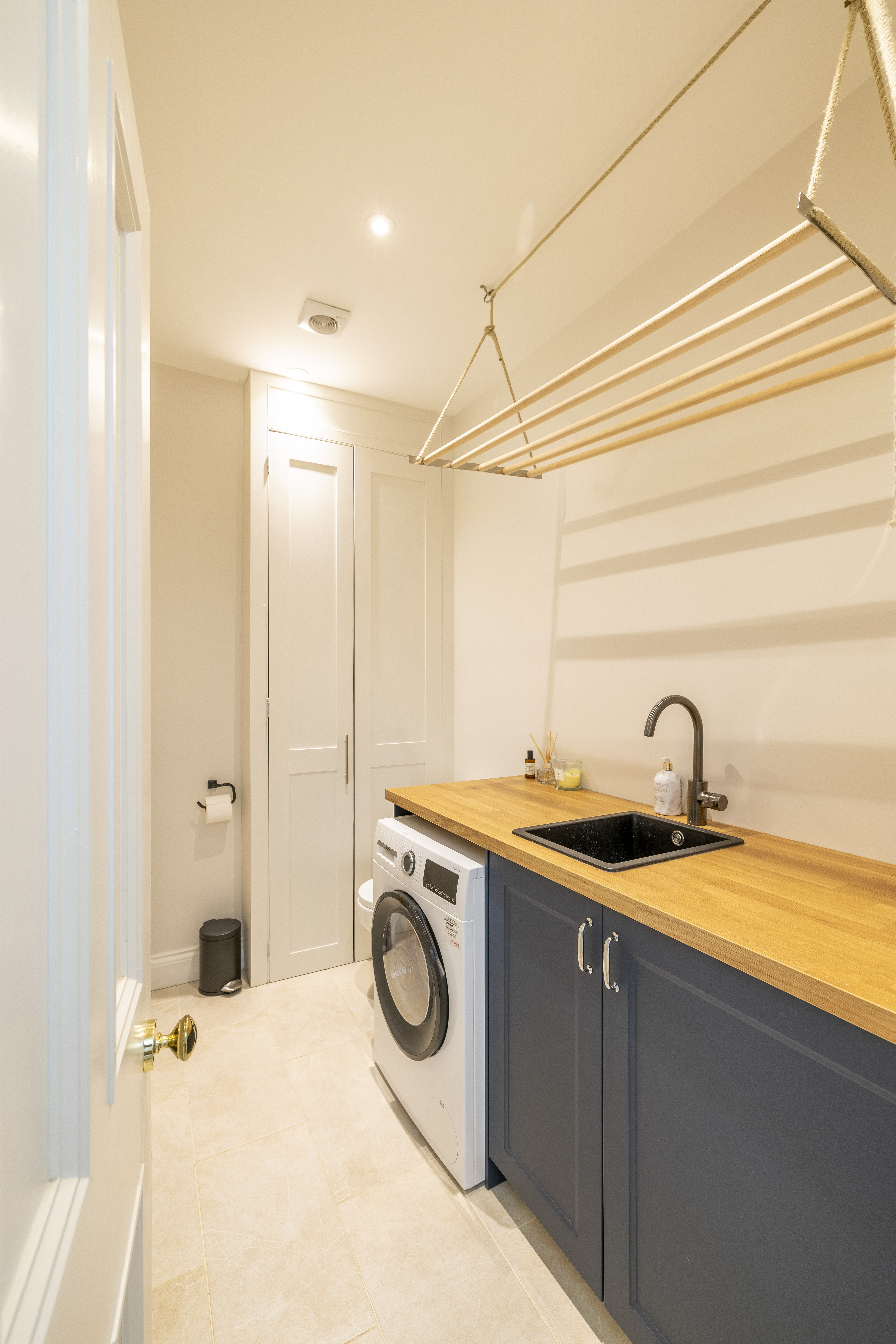 Belfast sink and floor-to-ceiling cabinetry at Milton Road SE24 kitchen extension