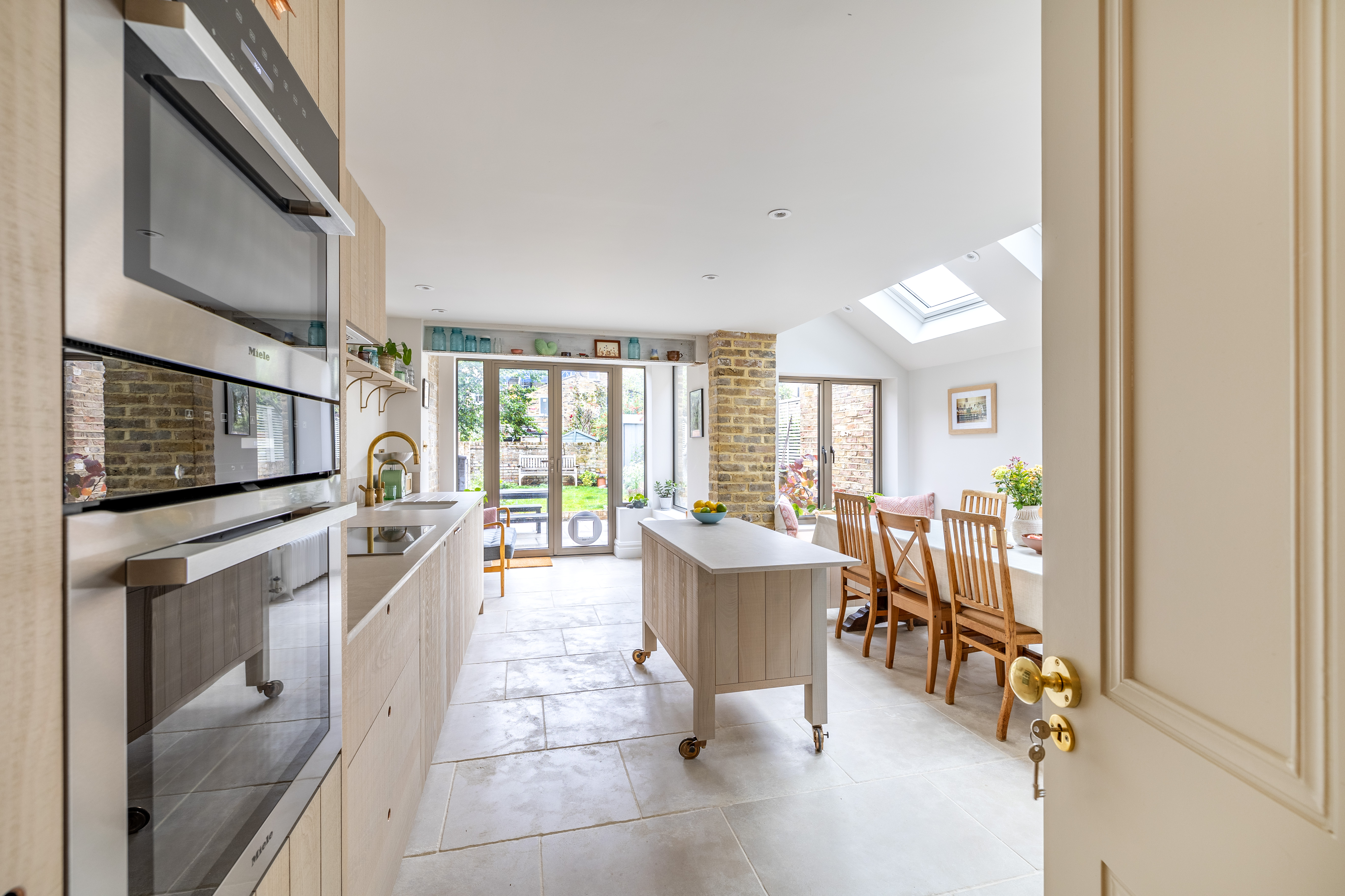 Before and after of the Lidfield Road extension, from tired conservatory to brick kitchen extension